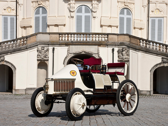 Ferdinand Porsche designed an electric vehicle, that caused a sensation at the Paris World Exhibition in 1900. This was soon followed by the first all wheel drive passenger car and marked the automotive engineering debut of four-wheel brakes. In 1900 he combined his battery-powered wheel hub drive with a petrol engine, thus creating the serial hybrid drive principle.