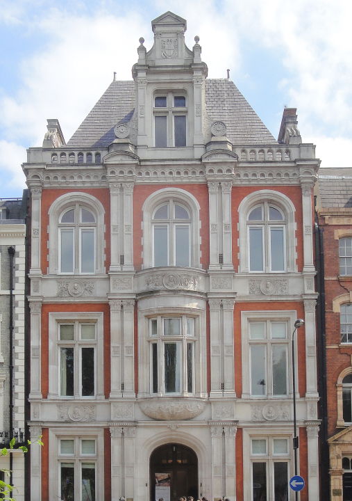 As its activities and influence increased, the College needed larger quarters. The architect Frederick Pinches designed a new building in red brick with dressings of Portland stone, and carved stone panels above the ground and first floor windows decorated with medallions of famous educators from John Locke and John Milton to Pestalozzi and Froebel.