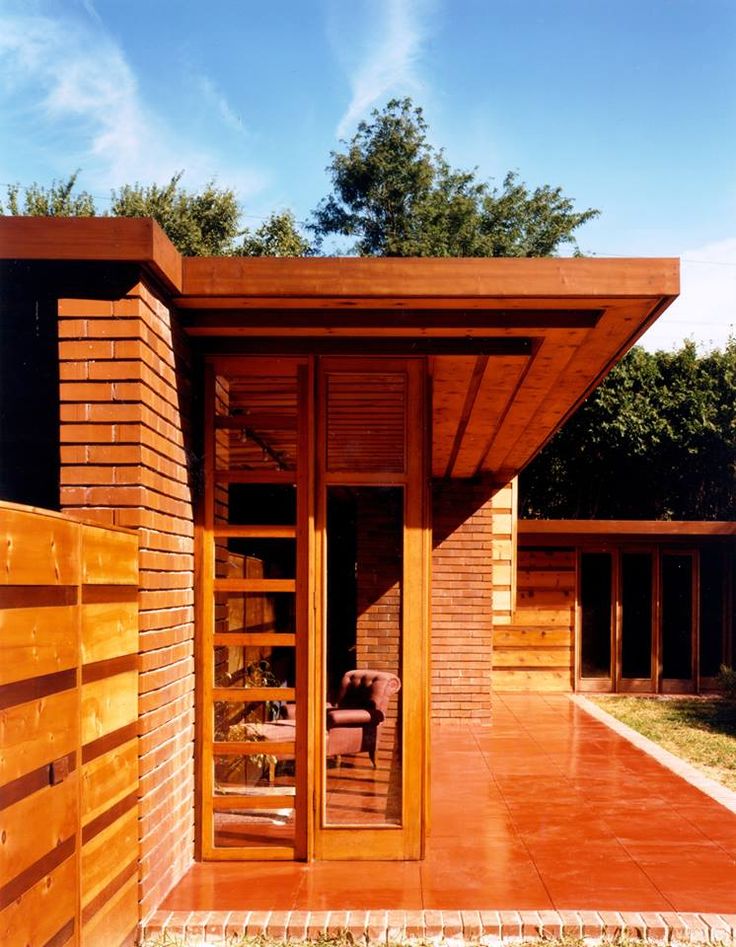 The materials of the Usonian house were to be recognized as nature's own: wood, stone, or baked clay in the form of bricks, and glass curtain walls, clerestories, and casement windows sheltered under overhanging soffits.